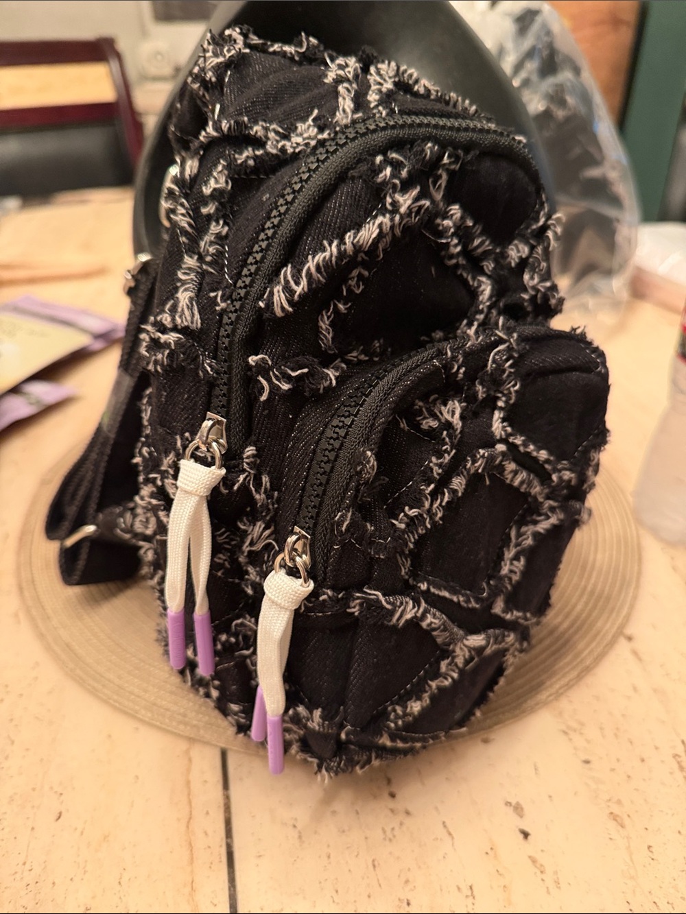 Wildfox Black Sling Backpack with White Frayed Denim and Lavender Zipper Tips